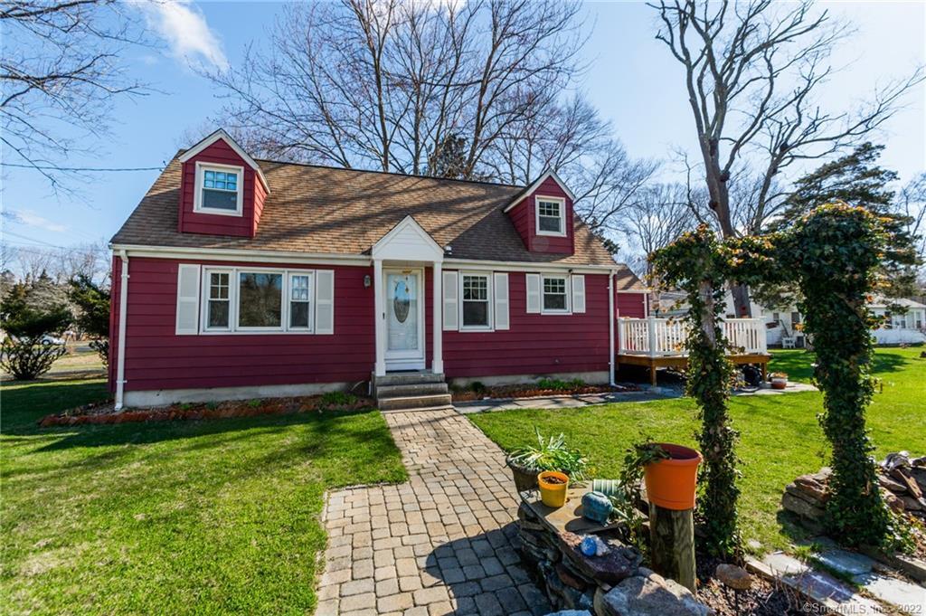 6 Noyes Road Old Lyme, CT 06371 - Photo 1 of 1 a front view of a house with garden
