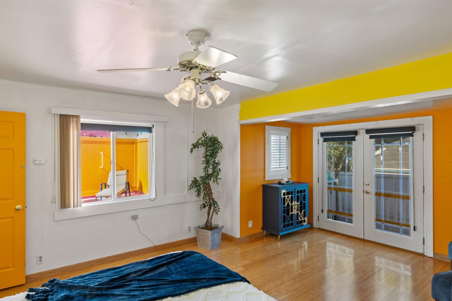 309 9th Street Pacific Grove, CA 93950 - Photo 11 of 36 a view of an empty room with window and wooden floor