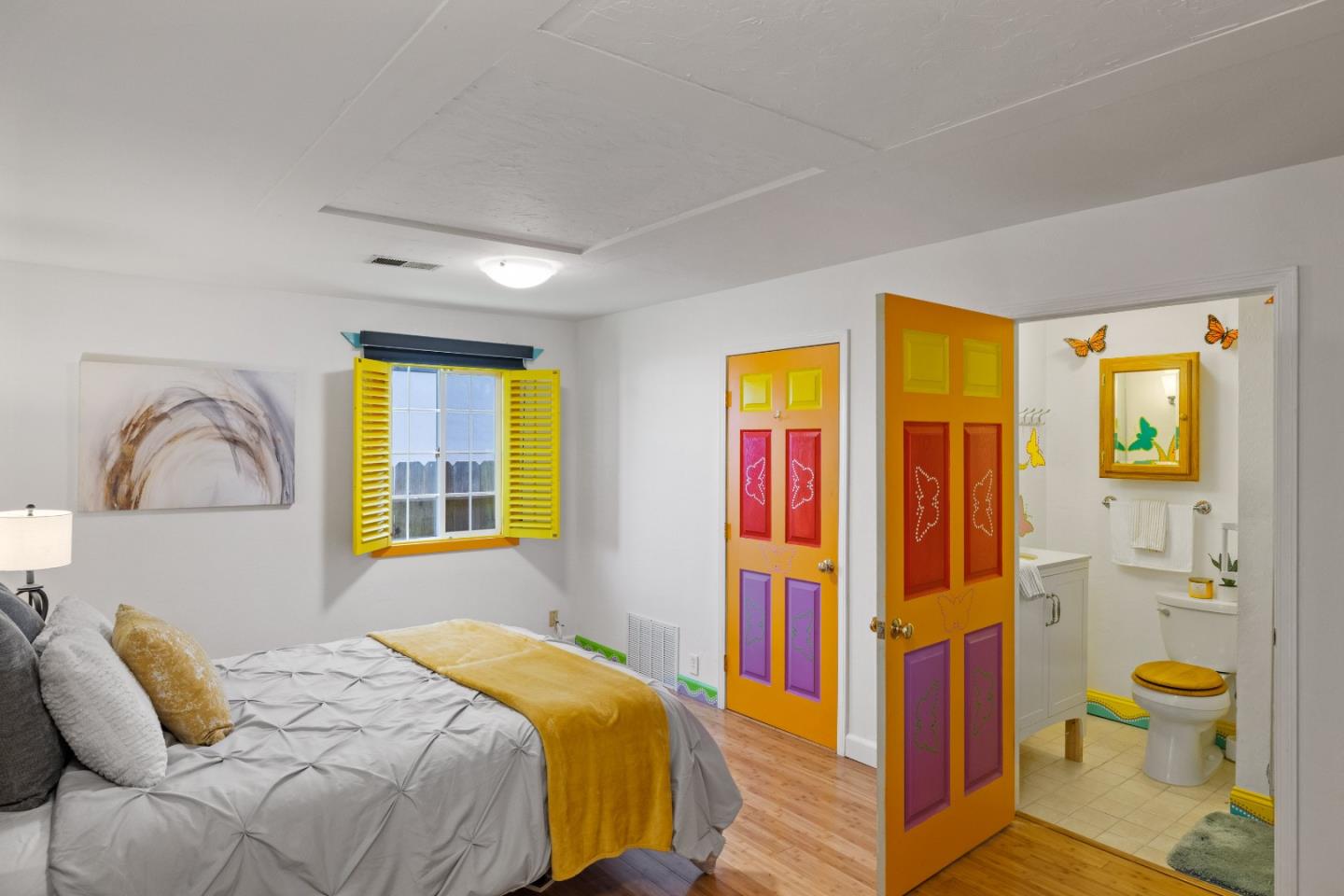 309 9th Street Pacific Grove, CA 93950 - Photo 17 of 36 a bedroom with a bed and a window