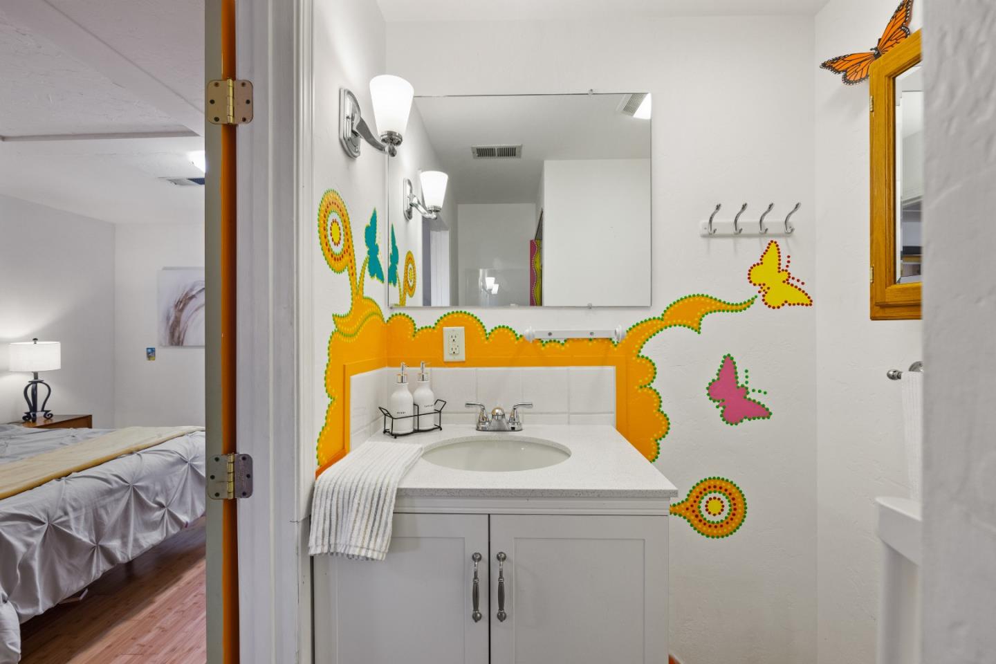 309 9th Street Pacific Grove, CA 93950 - Photo 22 of 36 a bathroom with a sink and mirror