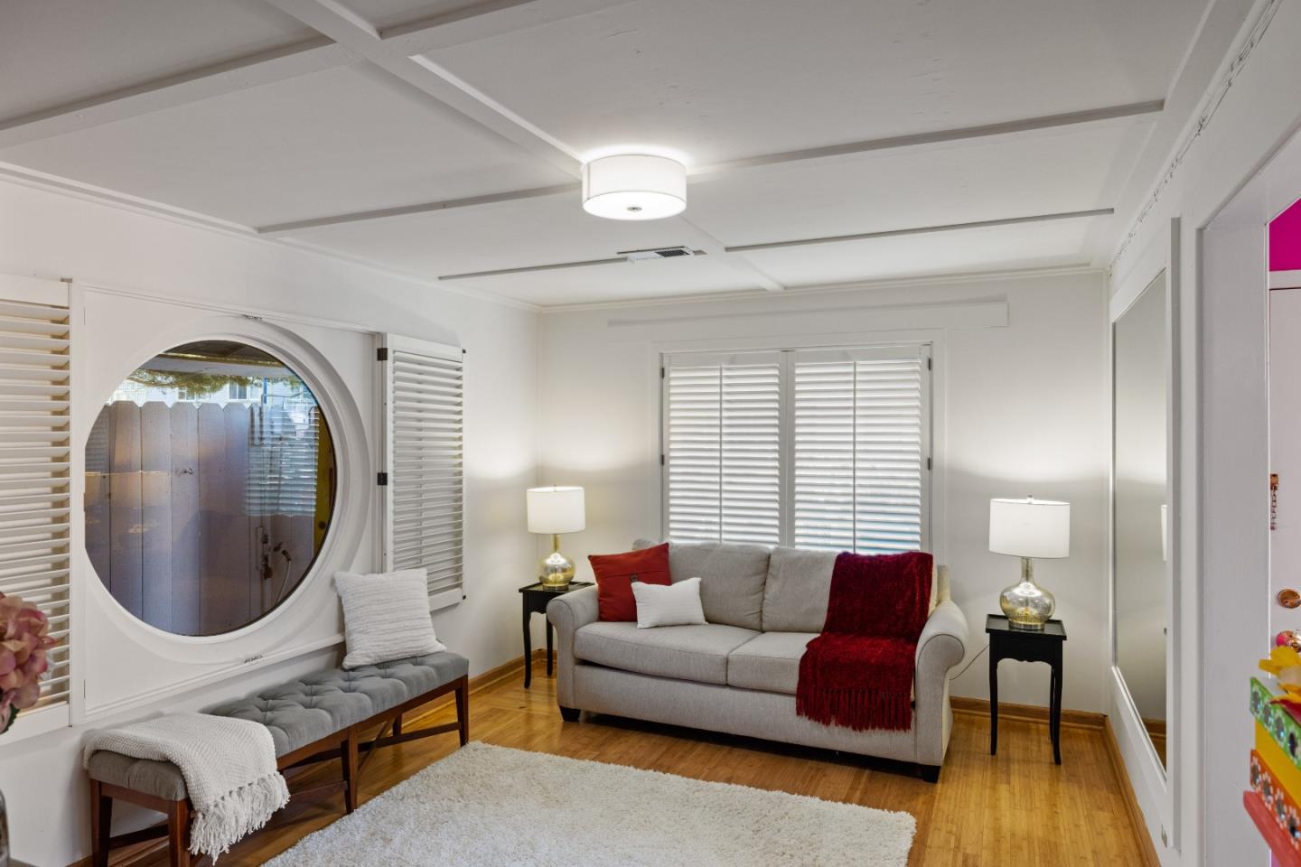 309 9th Street Pacific Grove, CA 93950 - Photo 4 of 36 a living room with furniture and a mirror