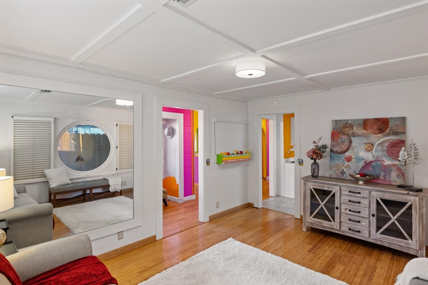309 9th Street Pacific Grove, CA 93950 - Photo 5 of 36 a bedroom with furniture and a mirror