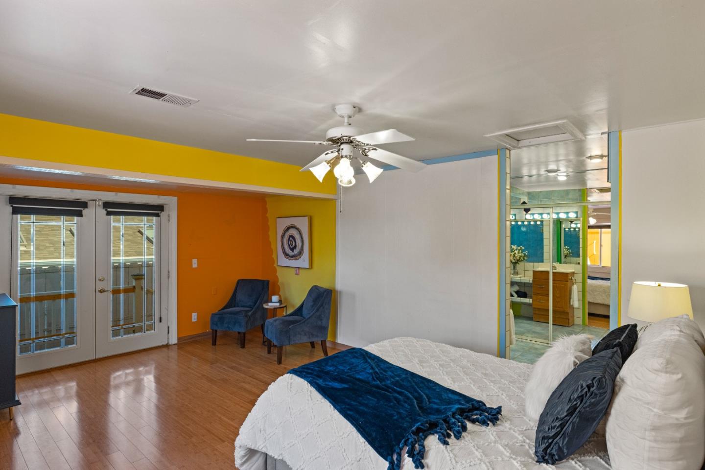 309 9th Street Pacific Grove, CA 93950 - Photo 7 of 36 a bedroom with a bed and wooden floor