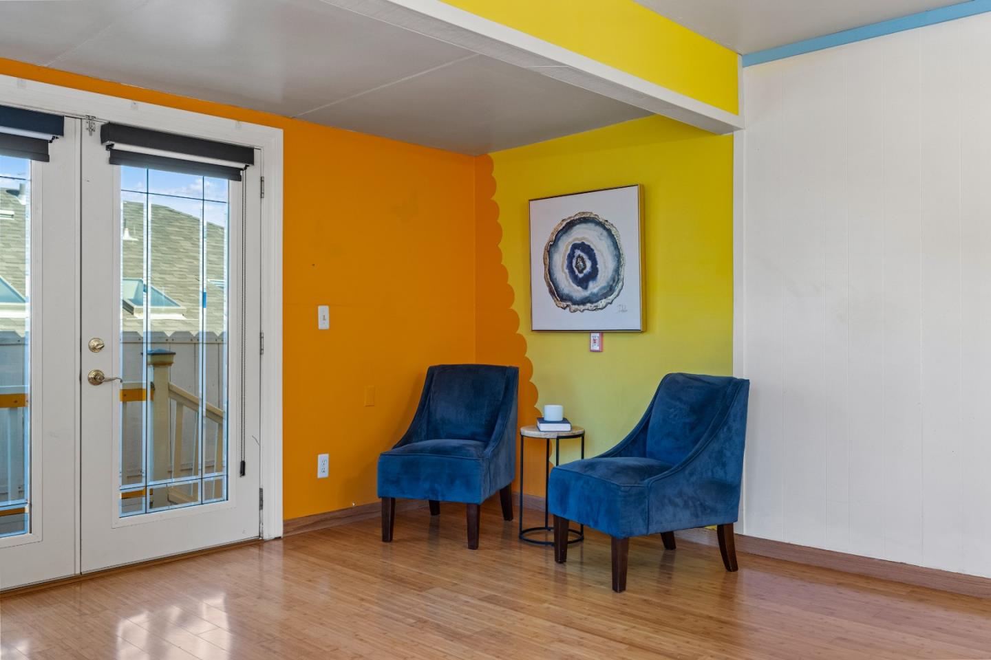 309 9th Street Pacific Grove, CA 93950 - Photo 8 of 36 a blue chair sitting in a bathroom next to a blue wall