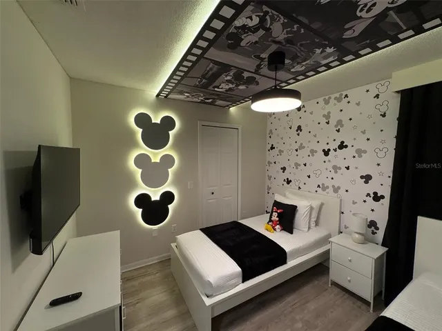 a bedroom with a bed and cabinets