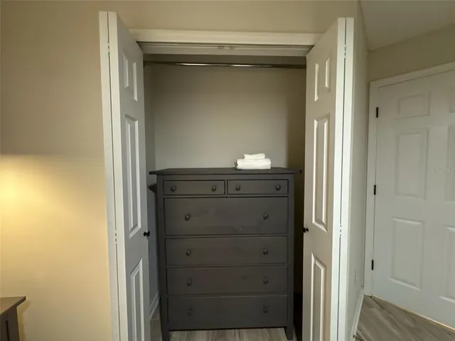 a room with pool table and windows