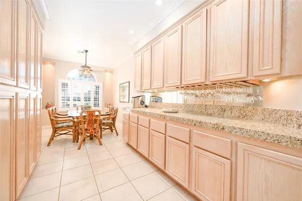 a kitchen with granite countertop sink cabinets and outdoor view