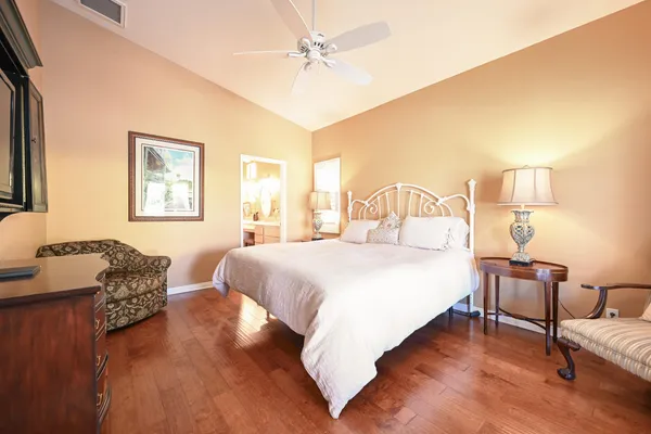 a bedroom with bed and a night stand