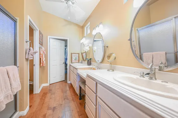 a bathroom with a double vanity sink and a mirror