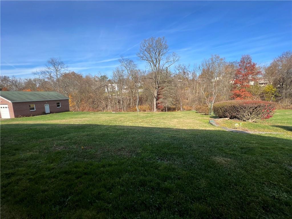441 Trestle Road Pittsburgh, PA 15239 - Photo 2 of 3 a swimming pool is in the middle of a big yard