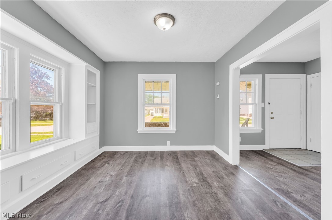 12808 Havana Road Cleveland, OH 44125 - Photo 7 of 19 Light gray interior walls with wood-finish flooring
