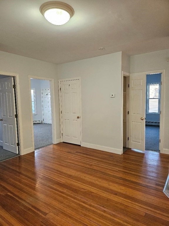 403 Manchester Street, Unit 3 Fall River, MA 02721 - Photo 6 of 15 a view of empty room with wooden floor
