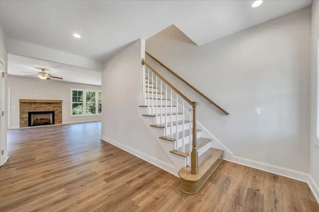 a view of entryway and hall with wooden floor
