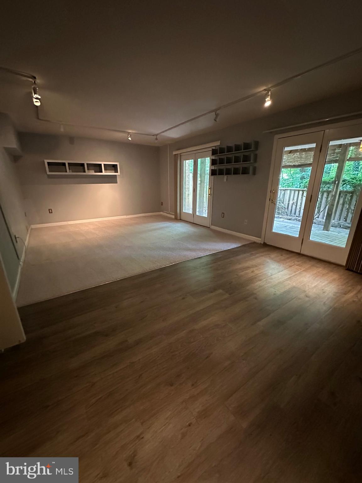 11152 Forest Edge Drive Reston, VA 20190 - Photo 18 of 102 an empty room with wooden floor and windows
