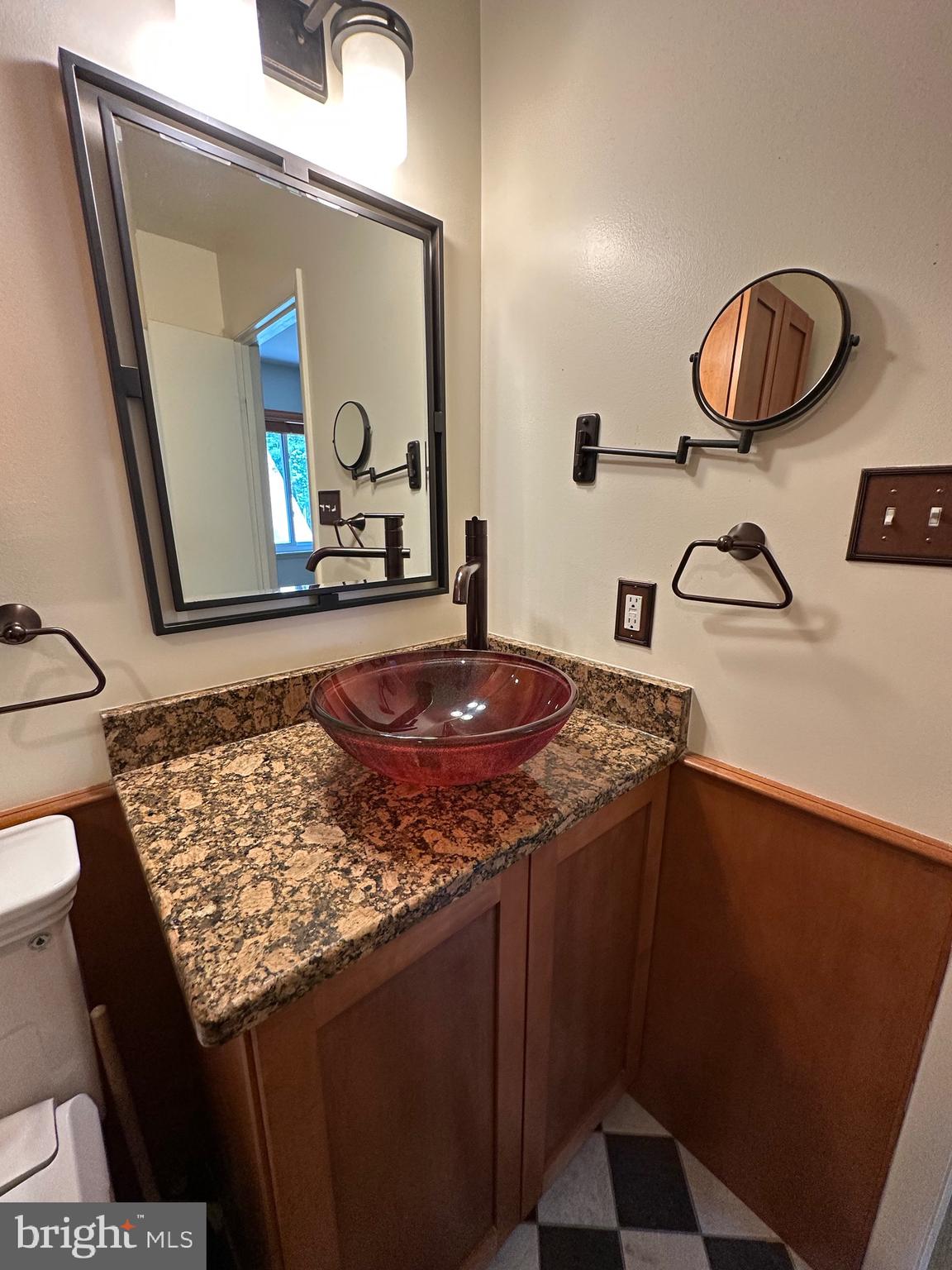 11152 Forest Edge Drive Reston, VA 20190 - Photo 41 of 102 a bathroom with a granite countertop sink and a mirror