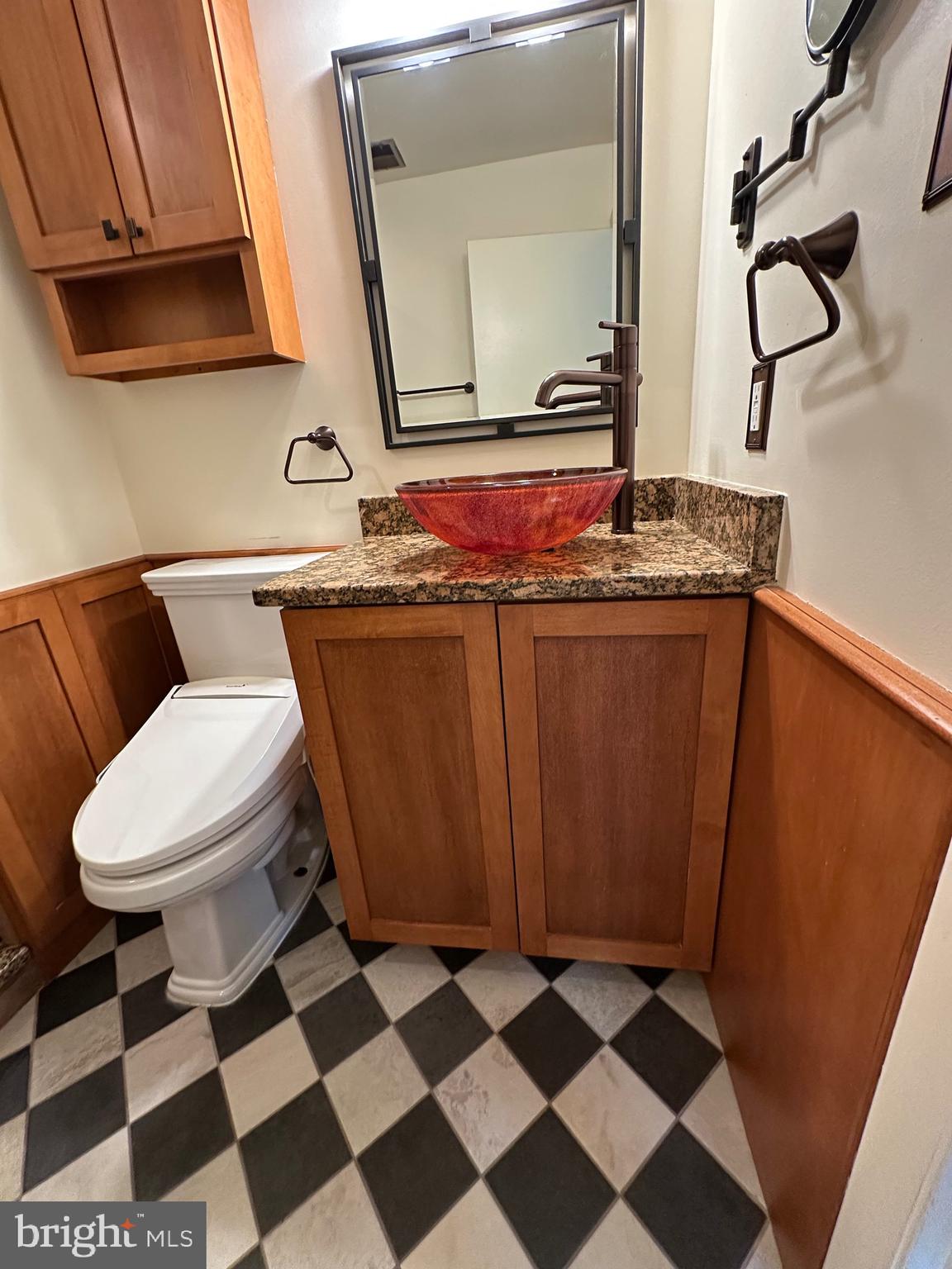11152 Forest Edge Drive Reston, VA 20190 - Photo 42 of 102 a bathroom with a toilet and a mirror