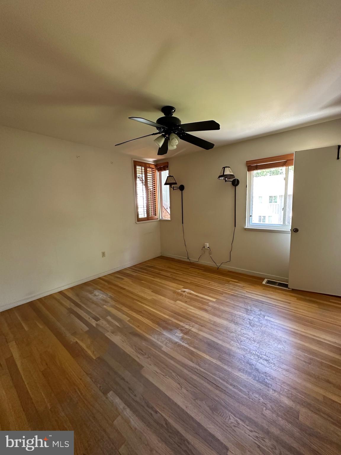 11152 Forest Edge Drive Reston, VA 20190 - Photo 48 of 102 a view of empty room with wooden floor and fan