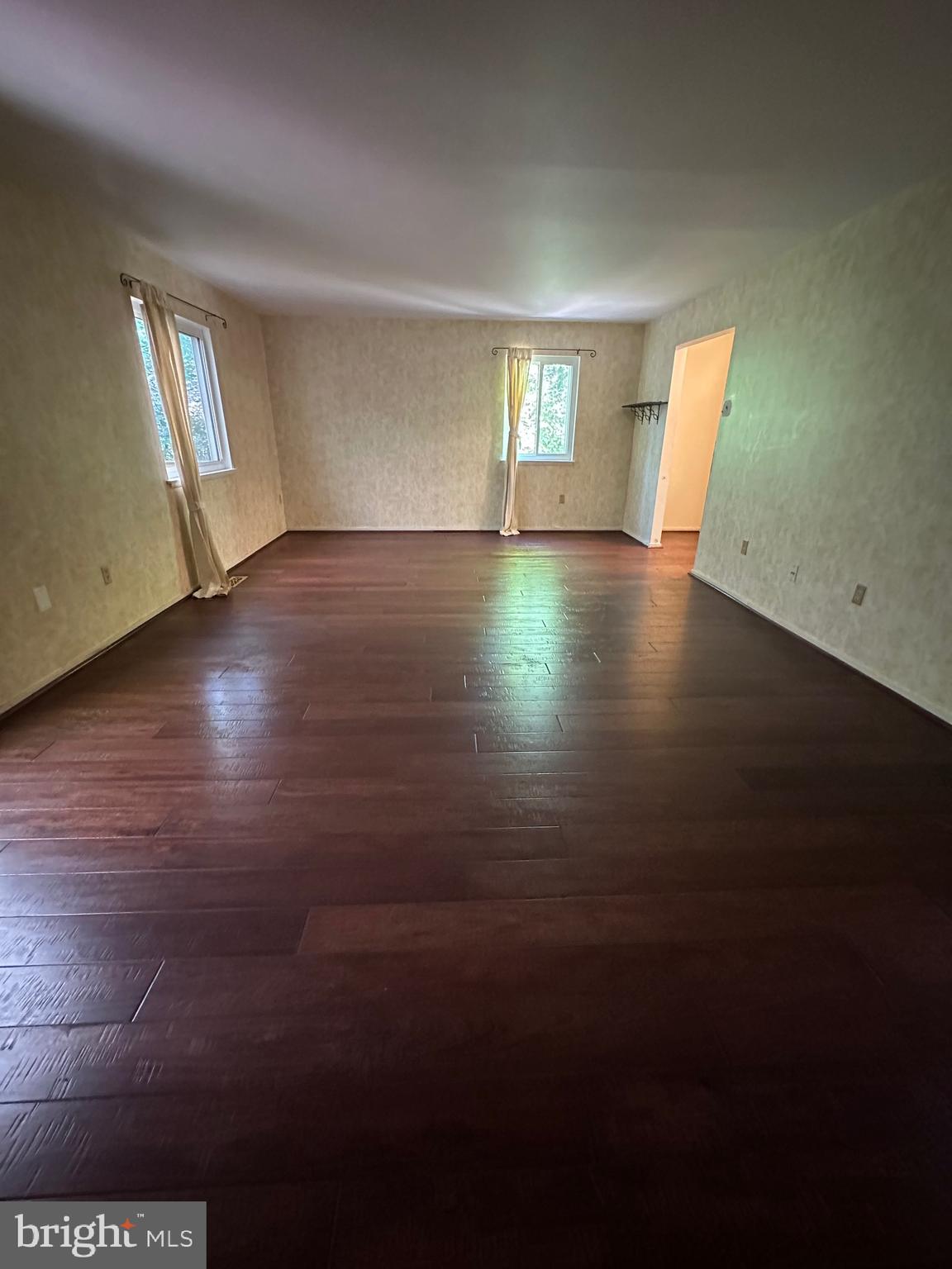 11152 Forest Edge Drive Reston, VA 20190 - Photo 66 of 102 a view of an empty room with wooden floor and a window