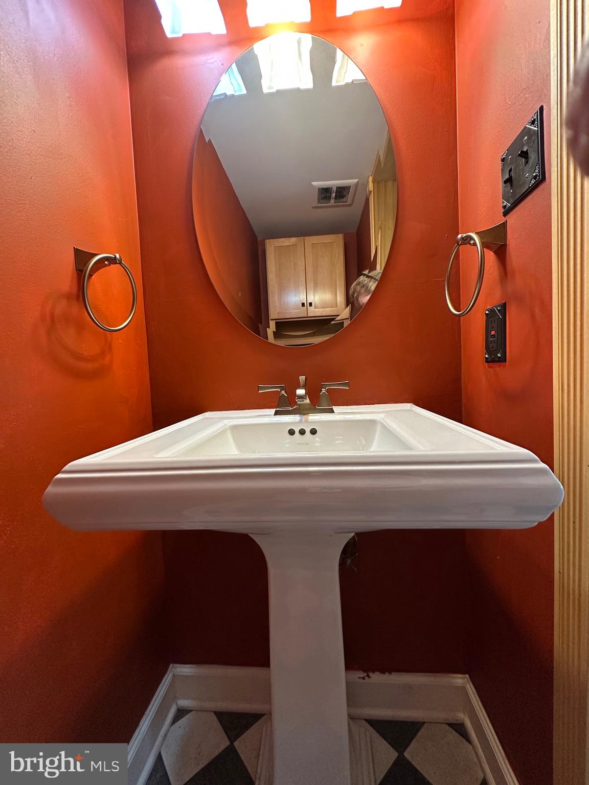 11152 Forest Edge Drive Reston, VA 20190 - Photo 70 of 102 a bathroom with a sink mirror and toilet