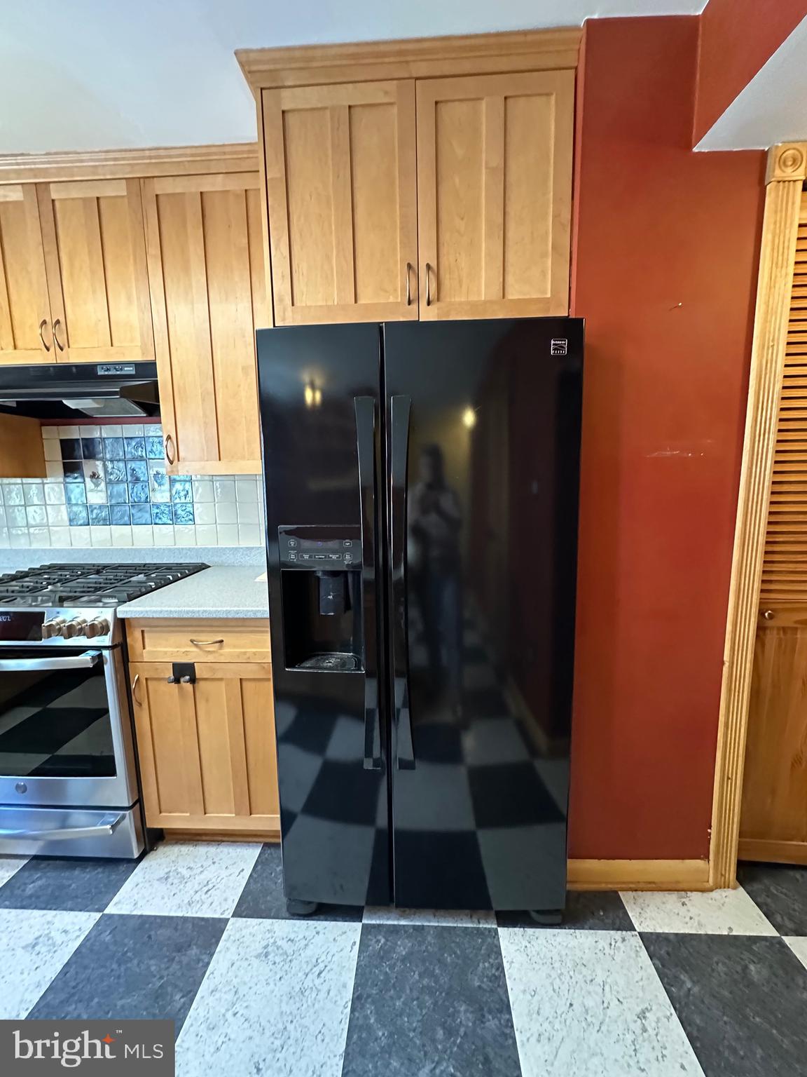 11152 Forest Edge Drive Reston, VA 20190 - Photo 81 of 102 a view of a kitchen with wooden cabinets