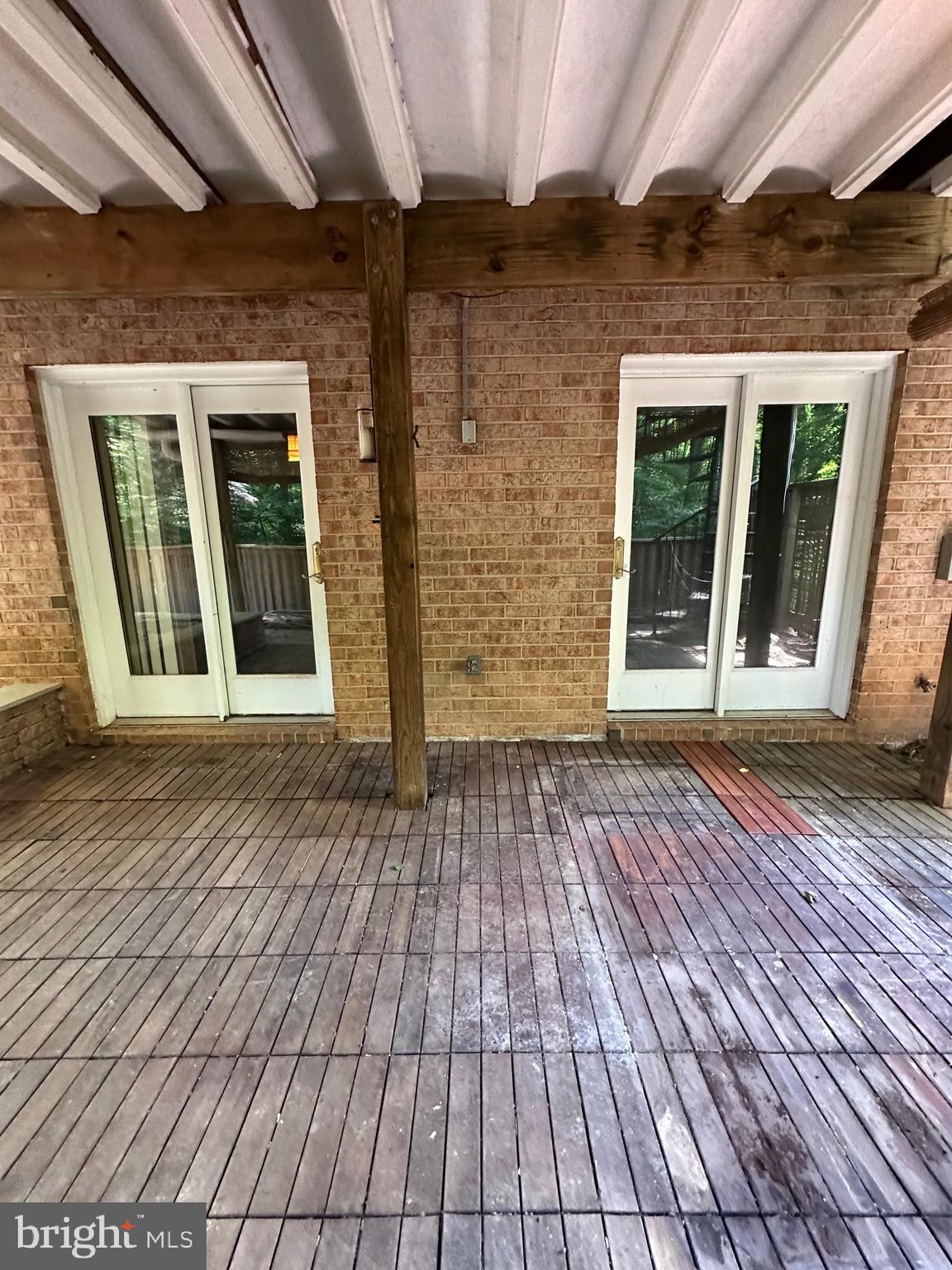 11152 Forest Edge Drive Reston, VA 20190 - Photo 89 of 102 an empty room with wooden floor and windows