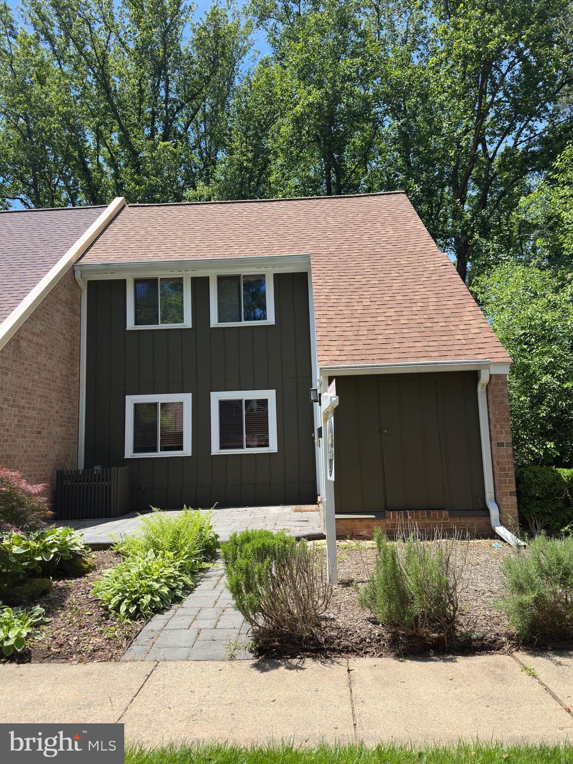 11152 Forest Edge Drive Reston, VA 20190 - Photo 98 of 102 a front view of a house with a yard
