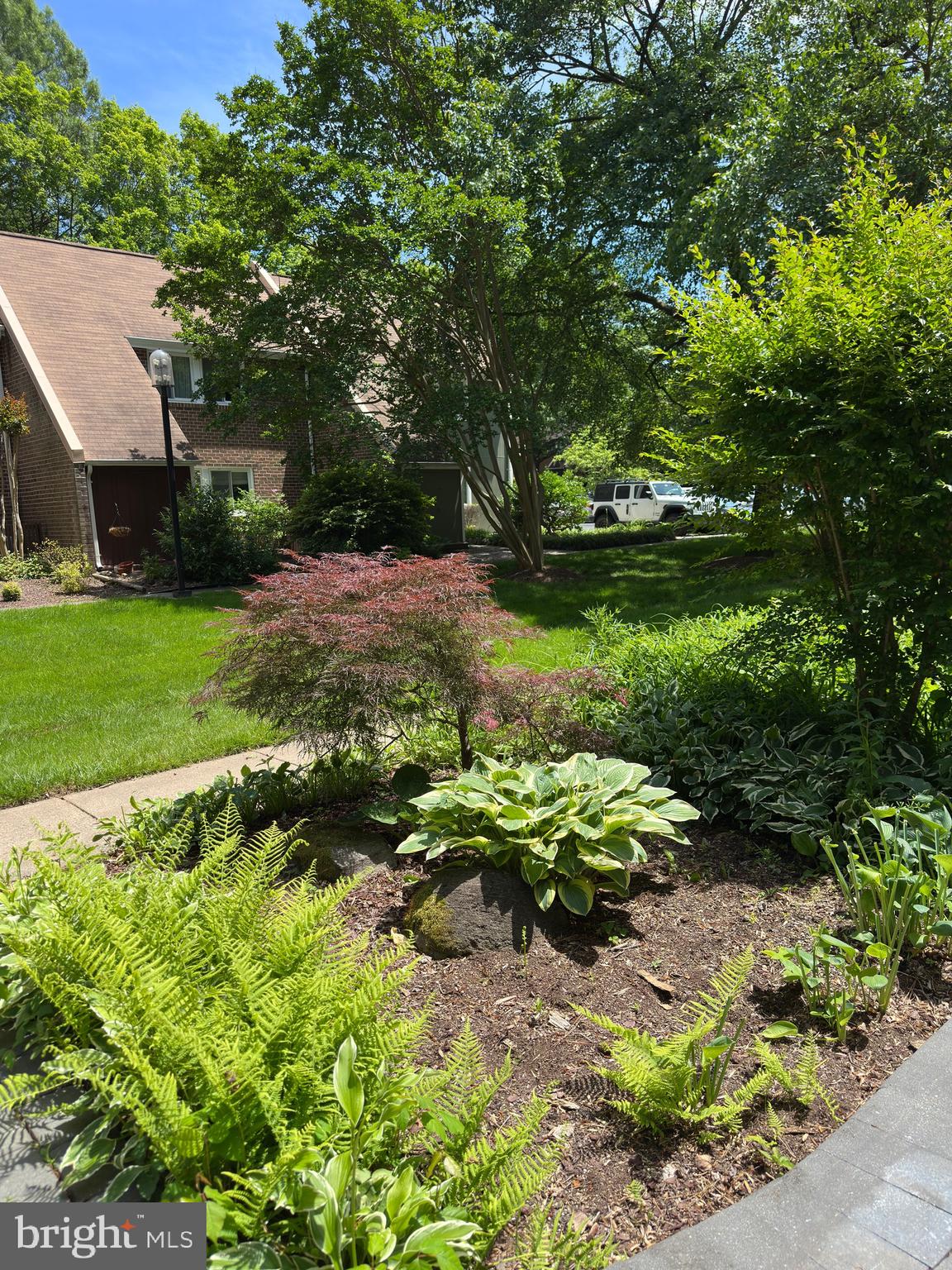 11152 Forest Edge Drive Reston, VA 20190 - Photo 99 of 102 a backyard of a house with a yard and outdoor seating