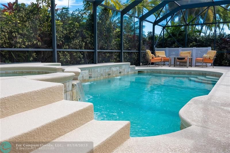 121 Landward Drive Jupiter, FL 33477 - Photo 1 of 43 a view of a swimming pool with a patio