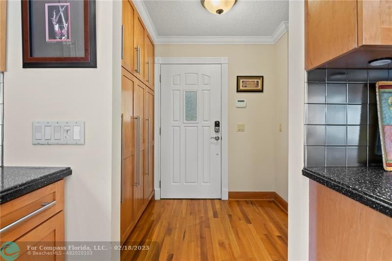 121 Landward Drive Jupiter, FL 33477 - Photo 12 of 43 a view of a livingroom with wooden floor and staircase