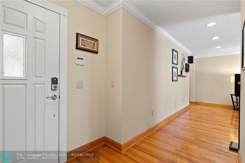 121 Landward Drive Jupiter, FL 33477 - Photo 13 of 43 a view of a hallway with wooden floor