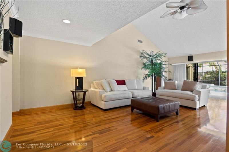 121 Landward Drive Jupiter, FL 33477 - Photo 14 of 43 a living room with furniture and a flat screen tv