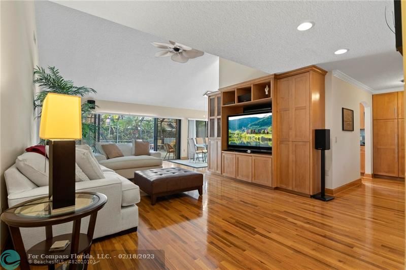 121 Landward Drive Jupiter, FL 33477 - Photo 15 of 43 a living room with furniture and a flat screen tv