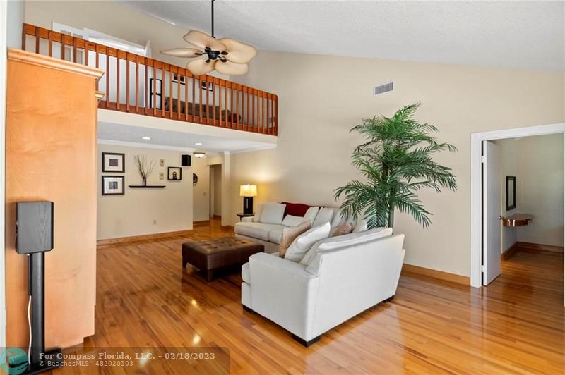 121 Landward Drive Jupiter, FL 33477 - Photo 18 of 43 a living room with furniture and a wooden floor