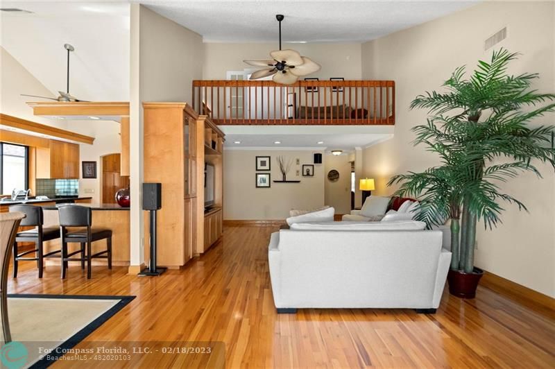 121 Landward Drive Jupiter, FL 33477 - Photo 23 of 43 a living room with furniture and a potted plant