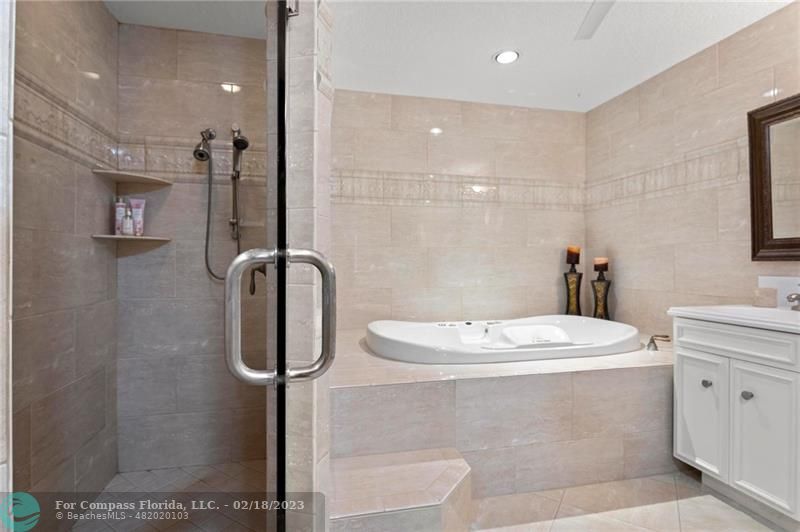 121 Landward Drive Jupiter, FL 33477 - Photo 29 of 43 a bathroom with a sink a toilet and shower