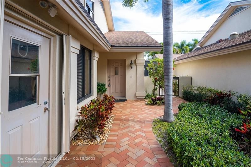 121 Landward Drive Jupiter, FL 33477 - Photo 3 of 43 a view of a house with porch and garden