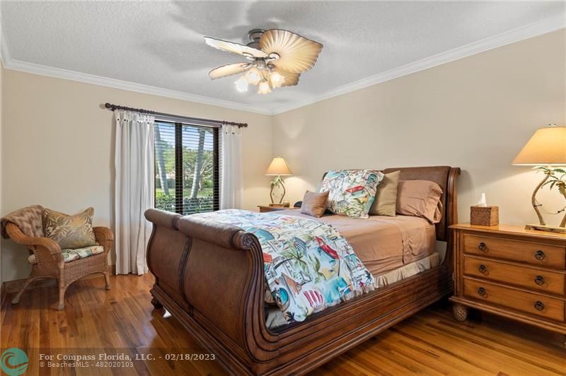 121 Landward Drive Jupiter, FL 33477 - Photo 31 of 43 a bedroom with a bed and window