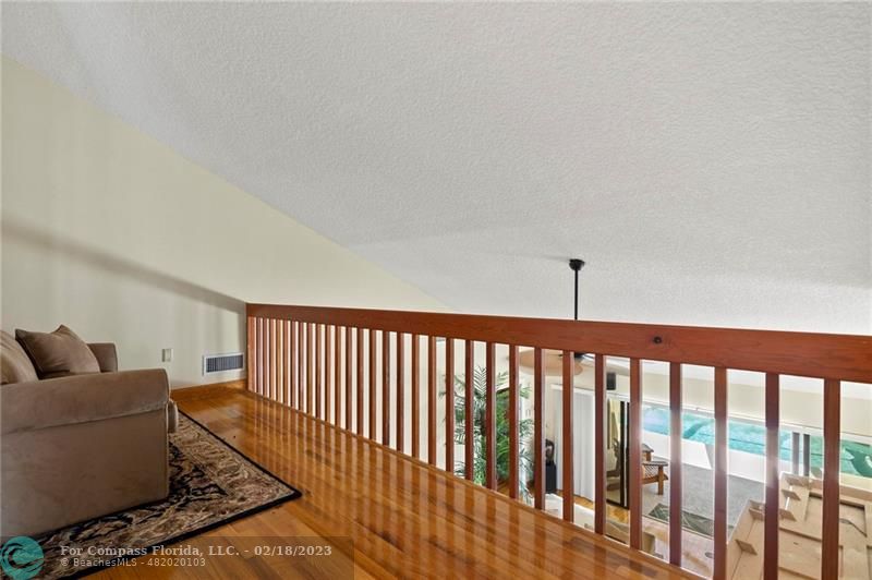 121 Landward Drive Jupiter, FL 33477 - Photo 38 of 43 a living room with furniture lamp and a rug