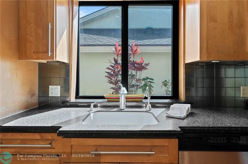 121 Landward Drive Jupiter, FL 33477 - Photo 41 of 43 a bathroom with a granite countertop sink and a mirror