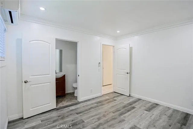 a bathroom with a sink shower and a mirror