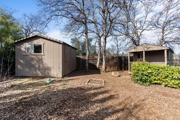 a view of a house with swimming pool and a yard