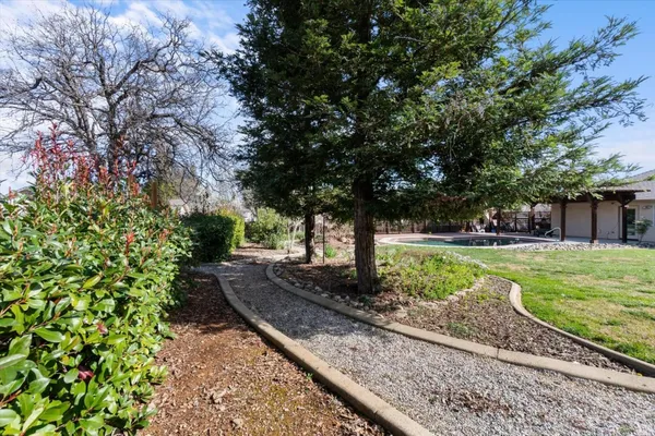 a view of a swimming pool with a patio