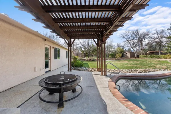 a view of a yard with swimming pool