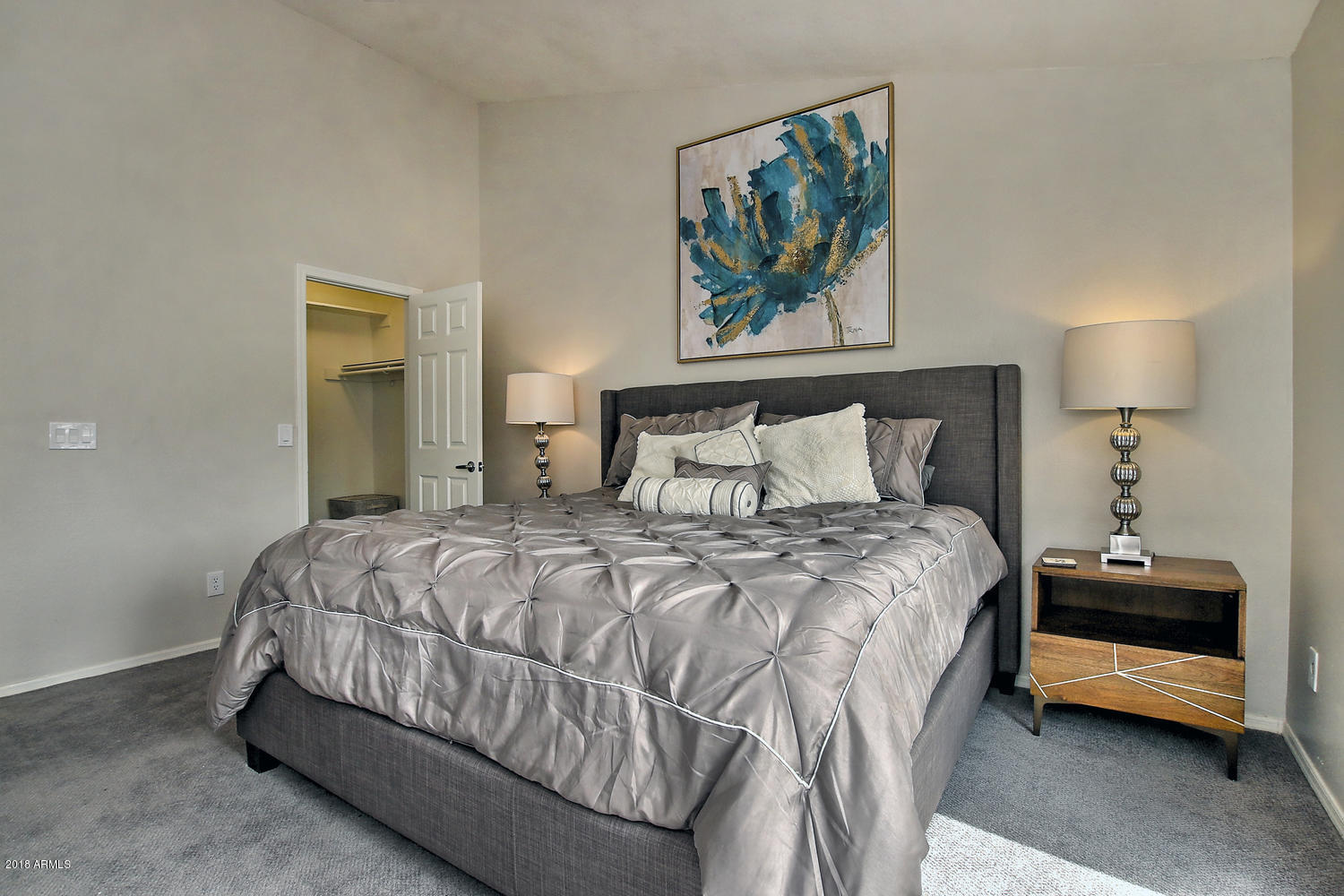 6521 East Grandview Drive Scottsdale, AZ 85254 - Photo 17 of 27 a bedroom with a bed a painting on the wall and a painting on the wall