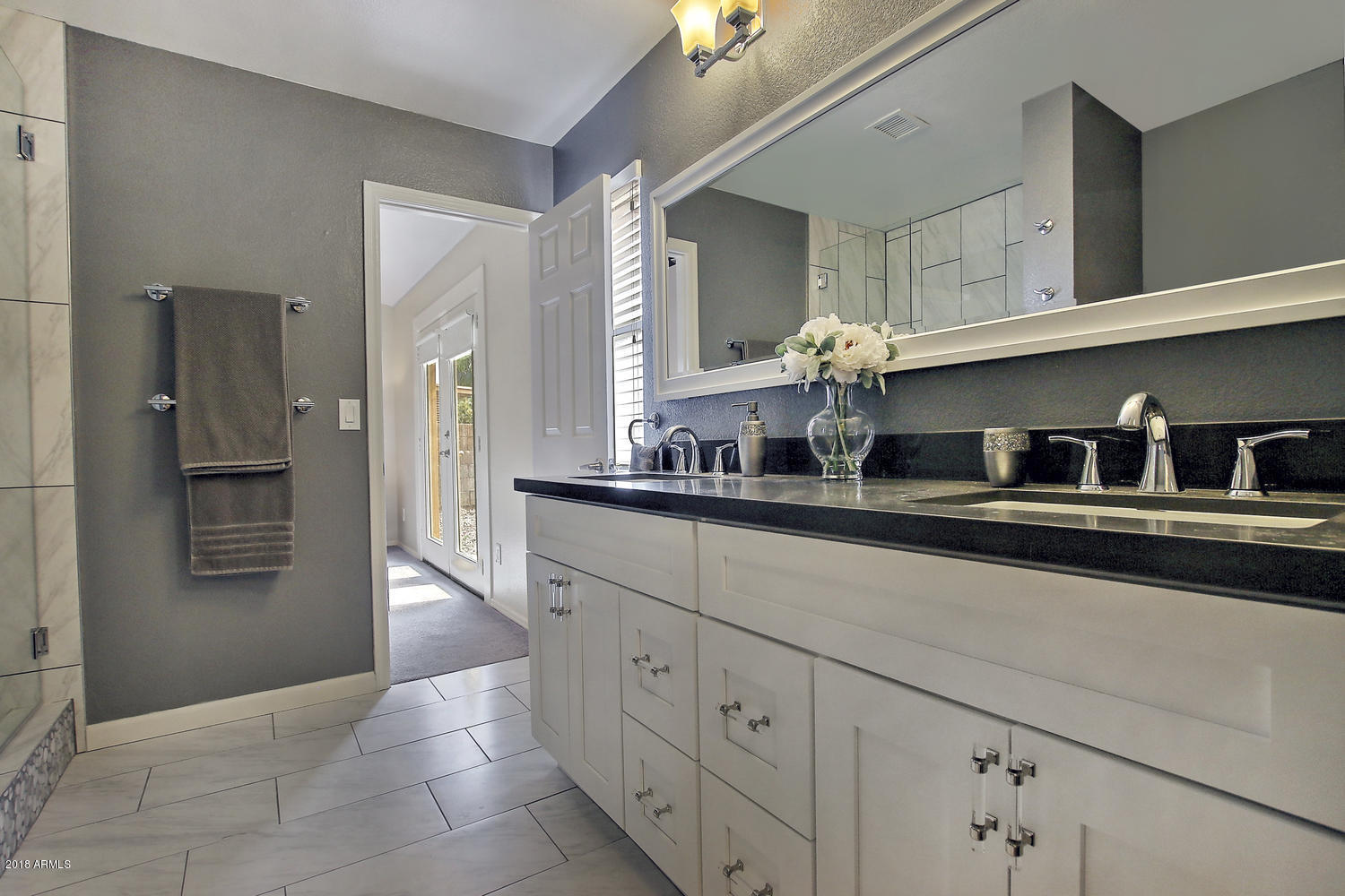 6521 East Grandview Drive Scottsdale, AZ 85254 - Photo 19 of 27 a kitchen with cabinets a sink and dishwasher