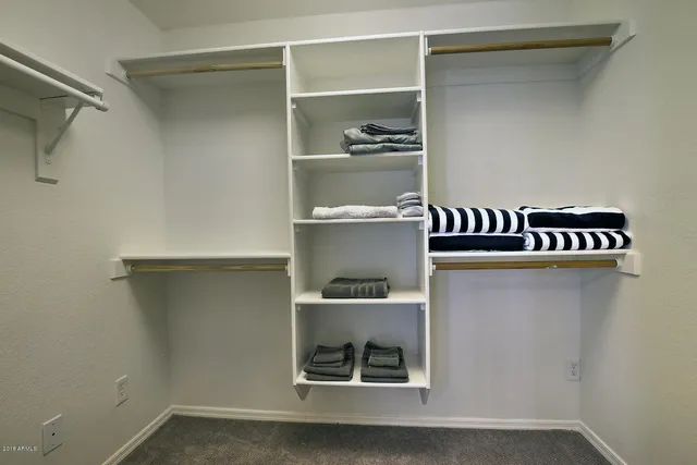 a shelf with cup and plates