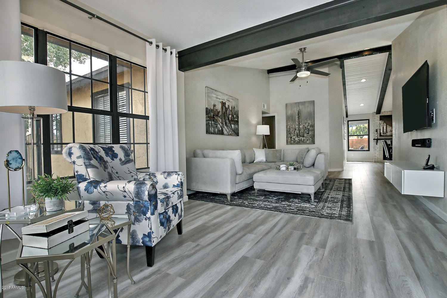 6521 East Grandview Drive Scottsdale, AZ 85254 - Photo 2 of 27 a living room with furniture and a flat screen tv