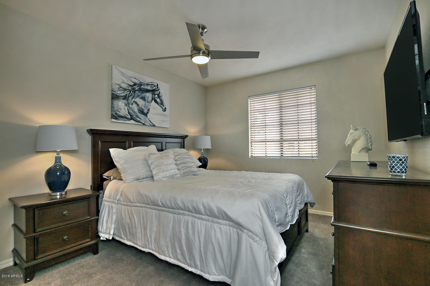 6521 East Grandview Drive Scottsdale, AZ 85254 - Photo 22 of 27 a bedroom with a bed and window