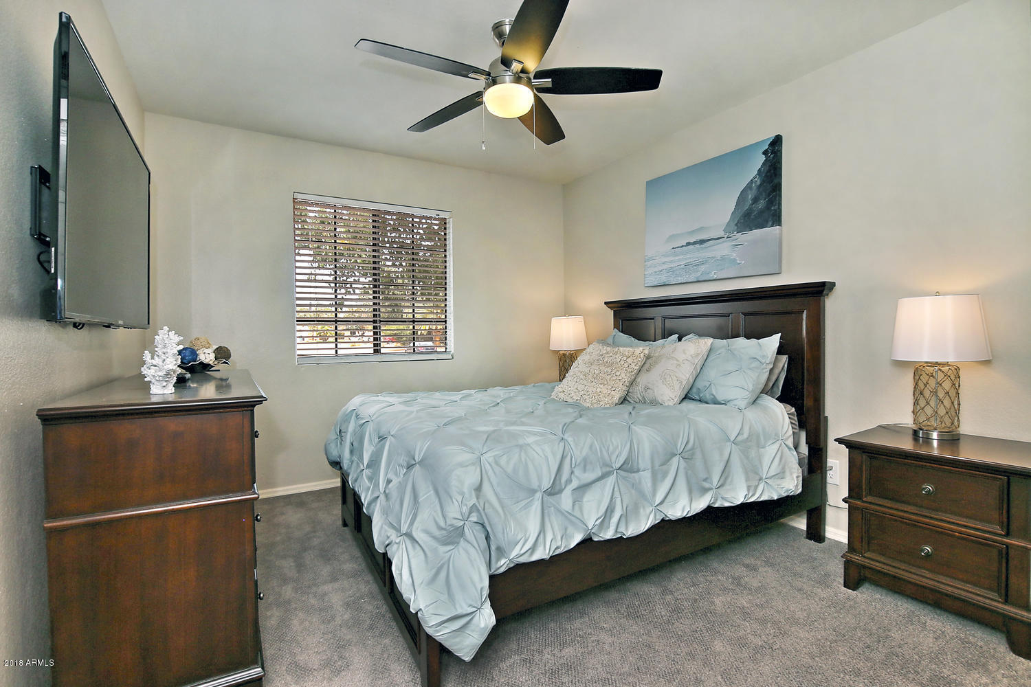 6521 East Grandview Drive Scottsdale, AZ 85254 - Photo 25 of 27 a bedroom with a bed and a flat tv screen on dresser