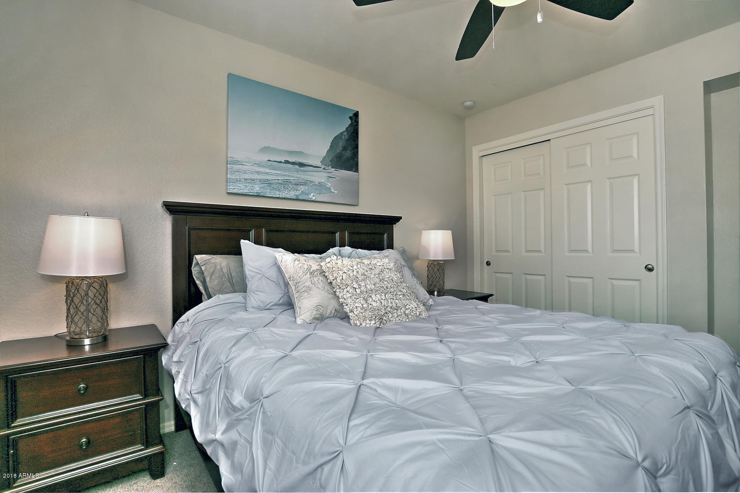 6521 East Grandview Drive Scottsdale, AZ 85254 - Photo 26 of 27 a bedroom with a bed and a lamp